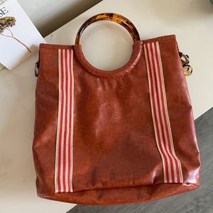 Purse with tort circle handles, never used.